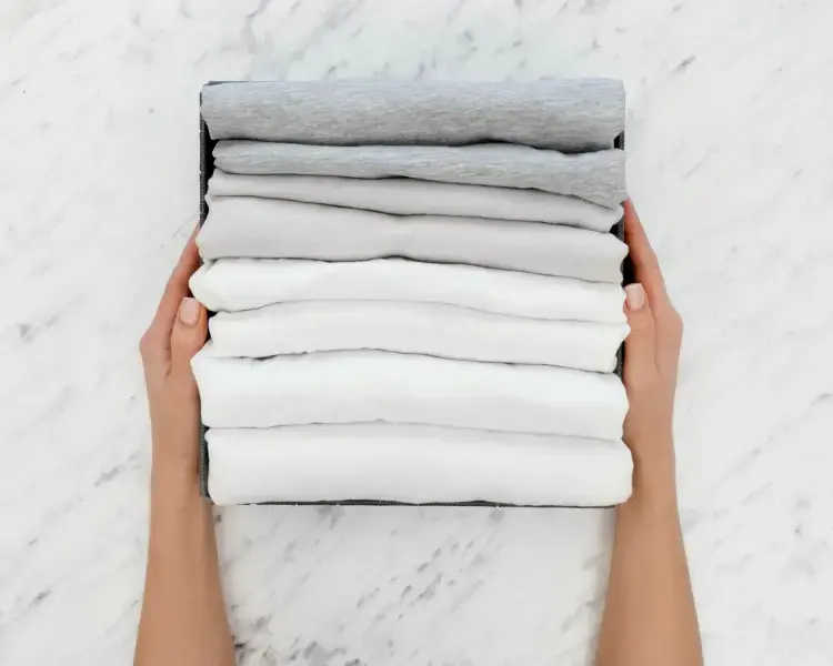 NoScrubs laundry service showing clean, folded clothes and professional service delivery for individuals, families, and businesses in Austin and Houston