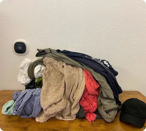 Assorted clothes folded representing about 20lbs of laundry